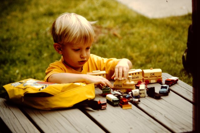 Phillip with his cars and trains