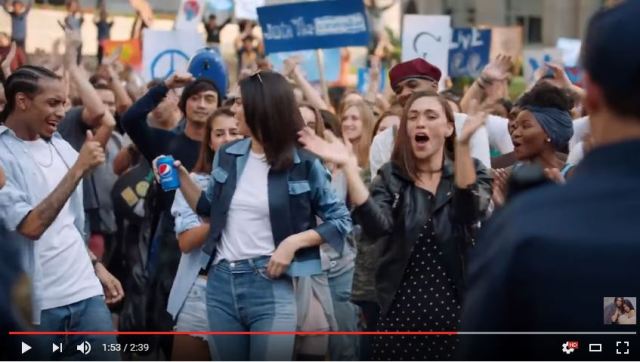 white model accepted by ultra cool black male dance through pepsi into leadership